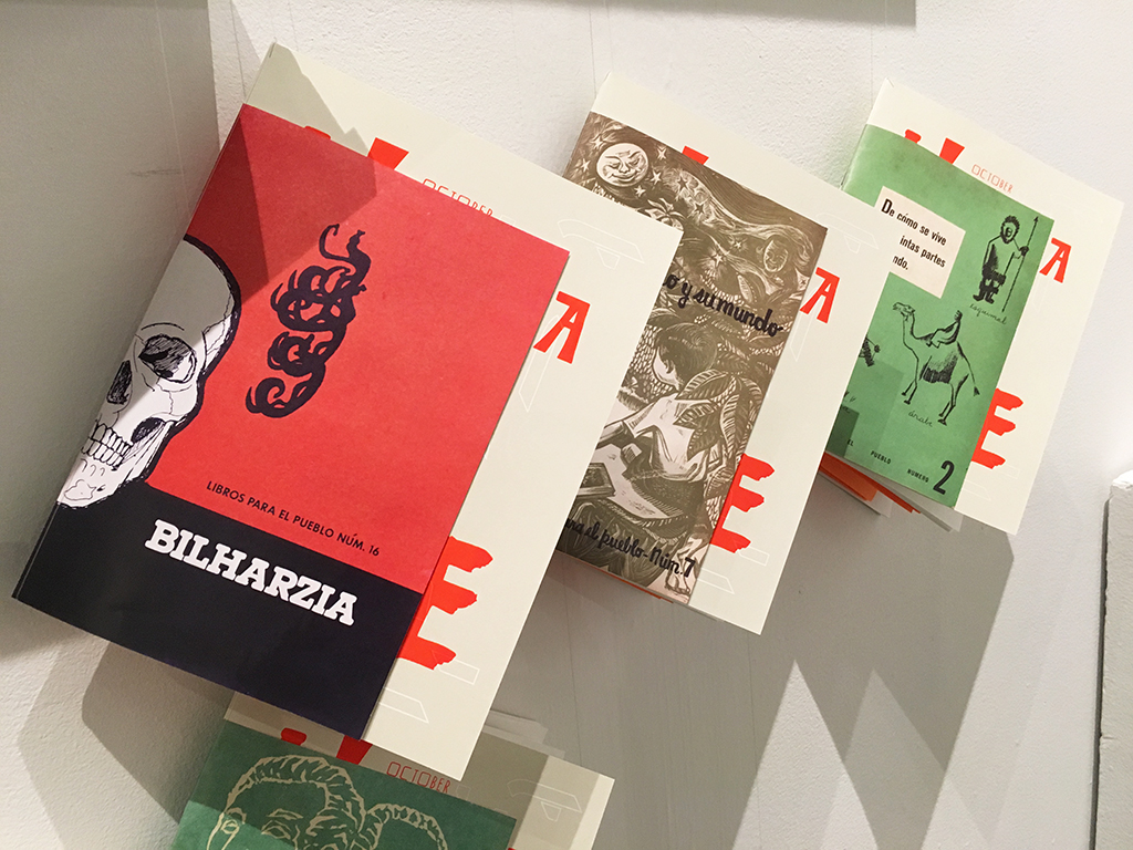The assorted covers for the Almanaque on display at VCFA at the October 2015 residency.
